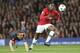 Bayern's Rafinha, left, fails to stop Manchester United's Danny Welbeck during the Champions League quarterfinal first leg soccer match between Manchester United and Bayern Munich at Old Trafford Stadium, Manchester, England, Tuesday, April 1, 2014.(AP Photo/Jon Super)