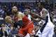 Chicago Bulls' Taj Gibson, left, looks to pass as he is guarded by Orlando Magic's Andrew Nicholson during the first half of an NBA basketball game in Orlando, Fla., Wednesday, Jan. 15, 2014.(AP Photo/John Raoux)