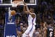 Oklahoma City Thunder forward Kevin Durant dunks in front of Miami Heat forward LeBron James (6) during the first quarter of an NBA basketball game in Oklahoma City, Thursday, Feb. 20, 2014. (AP Photo/Sue Ogrocki)