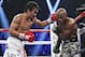 Manny Pacquiao, left, of the Philippines, drives Timothy Bradley into the ropes in their WBO welterweight title boxing bout Saturday, April 12, 2014, in Las Vegas. Pacquiao won by unanimous decision. (AP Photo/Isaac Brekken)