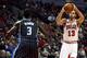Chicago Bulls center Joakim Noah (13) shoots over Orlando Magic center Dewayne Dedmon (3) during the second half of an NBA basketball game Monday, April 14, 2014, in Chicago. The Bulls won the game 108-95. (AP Photo/Jeff Haynes)