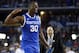 Apr 5, 2014; Arlington, TX, USA; Kentucky Wildcats forward Julius Randle (30) celebrates after defeating the Wisconsin Badgers in the semifinals of the Final Four in the 2014 NCAA Mens Division I Championship tournament at AT&T Stadium. Mandatory Credit: Robert Deutsch-USA TODAY Sports