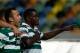 Sporting's William Carvalho, right, celebrates after scoring the opening goal against Pacos de Ferreira during their Portuguese league soccer match Sunday, Dec. 1, 2013, at Sporting's Alvalade stadium in Lisbon. (AP Photo/Armando Franca)