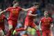 Liverpool's Philippe Coutinho right, celebrates with team-mate Steven Gerrard left, after he scores the third goal of the game for his side during their English Premier League soccer match against Manchester City at Anfield in Liverpool, England, Sunday April. 13, 2014. (AP Photo/Clint Hughes)