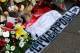 Tributes are laid at the memorial of the Hillsborough disaster outside Anfield before the English Premier League soccer match between Liverpool and Manchester City at Anfield in Liverpool, England, Sunday April. 13, 2014. (AP Photo/Clint Hughes)