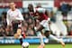 LONDON, ENGLAND - APRIL 06: Mohamed Diame of West Ham is closed down by Jordan Henderson of Liverpool during the Barclays Premier League match between West Ham United and Liverpool at Boleyn Ground on April 6, 2014 in London, England. (Photo by Julian Finney/Getty Images)
