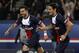 Paris Saint Germain's Ezequiel Lavezzi, left, celebrates with teammate Edinson Cavani, after scoring during their French League one soccer match against Sochaux, at the Parc des Princes stadium, in Paris, Saturday, Dec. 7, 2013. (AP Photo/Thibault Camus)