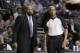 New York Knicks head coach Mike Woodson and referee Leon Wood watch from the sidelines during the second half of an NBA basketball game against the Detroit Pistons in Auburn Hills, Mich., Tuesday, Nov. 19, 2013. (AP Photo/Carlos Osorio)