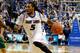 George Mason's Johnny Williams (2) tries to defend as Saint Louis' Jordair Jett (5) drives to the basket during the second half of an NCAA college basketball game on Saturday, Feb. 1, 2014, in St. Louis. (AP Photo/Scott Kane)