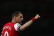 LONDON, ENGLAND - APRIL 15: Lukas Podolski of Arsenal celebrates as he scores their third goal during the Barclays Premier League match between Arsenal and West Ham United at Emirates Stadium on April 15, 2014 in London, England. (Photo by Paul Gilham/Getty Images)