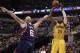 Indiana Pacers forward Paul George (24) shoots the basketball defended by Atlanta Hawks center Pero Antic in the second half of an NBA basketball game in Indianapolis, Sunday, April 6, 2014. Atlanta won 107-88. (AP Photo/R Brent Smith)