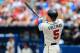 Apr 13, 2014; Atlanta, GA, USA; Atlanta Braves first baseman Freddie Freeman (5) hits a two run home run in the second inning against the Washington Nationals at Turner Field. Mandatory Credit: Daniel Shirey-USA TODAY Sports