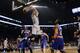 Brooklyn Nets' Mason Plumlee (1) dunks in front of New York Knicks' Tim Hardaway Jr. (5) during the first half of an NBA basketball game Tuesday, April 15, 2014, in New York. (AP Photo/Frank Franklin II)