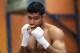 BOLTON, ENGLAND - MARCH 24: Amir Khan shadow boxes during a media workout at the Gloves Community Centre on March 24, 2014 in Bolton, England. (Photo by Alex Livesey/Getty Images)