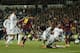 Barcelona's Lionel Messi from Argentina, centre left, scores his goal during a Spanish La Liga soccer match between Real Madrid and FC Barcelona at the Santiago Bernabeu stadium in Madrid, Spain, Sunday, March 23, 2014. (AP Photo/Andres Kudacki)