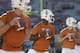 Texas' Tyrone Swoopes (18) goes through warmups with teammates David Ash, left, and Case McCoy (6) prior to an NCAA college football game against Kansas State, Saturday, Sept. 21, 2013, in Austin, Texas. (AP Photo/Eric Gay)
