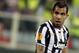 Juventus' Carlos Tevez walks on the pitch during an Europa League, round of 16, return-leg soccer match between Fiorentina and Juventus at the Artemio Franchi stadium in Florence, Italy, Thursday, March 20, 2014. (AP Photo/Fabrizio Giovannozzi)