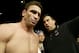 John McCarthy guides Ken Shamrock into the arena to fight Tito Ortiz for the light heavyweight bout as part of the Ultimate Fighting Championship 61 in Las Vegas on Saturday, July 8, 2006. Ortiz defeated Ken Shamrock in the bout. (AP Photo/Jane Kalinowsky)