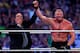 Paul Heyman, left, celebrates with Brock Lesnar after his win over the Undertaker during Wrestlemania XXX at the Mercedes-Benz Super Dome in New Orleans on Sunday, April 6, 2014. (Jonathan Bachman/AP Images for WWE)