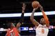 New York Knicks' J.R. Smith (8) shoots over Toronto Raptors' Terrence Ross (31) during the first half of an NBA basketball game Wednesday, April 16, 2014, in New York. (AP Photo/Frank Franklin II)