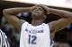 Buffalo's Javon McCrea reacts in the final seconds of the second half of an NCAA college basketball game against Eastern Michigan at the Mid-American Conference tournament Thursday, March 13, 2014, in Cleveland. Eastern Michigan defeated Buffalo 69-64. (AP Photo/Tony Dejak)
