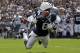 Penn State wide receiver Allen Robinson (8) hauls in a 43-yard pass from Penn State quarterback Christian Hackenberg with Eastern Michigan defensive back Willie Creear making the tackle during the first quarter of an NCAA college football game in State College, Pa., Saturday, Sept. 7, 2013. (AP Photo/Gene J. Puskar)