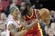 Houston Rockets guard James Harden, right, looks for a move to the basket as Portland Trail Blazers guard Damian Lillard defends during the second half of an NBA basketball game in Portland, Ore., Friday, April 5, 2013. Harden scored 33 points and pulled in 7 rebounds as the Rockets won 116-98. (AP Photo/Don Ryan)