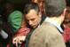 Oscar Pistorius, center, shares a hug with an unidentified woman as he leaves the high court in Pretoria, South Africa, Wednesday, April 16, 2014. Pistorius is charged with murder for the shooting death of his girlfriend, Reeva Steenkamp, on Valentines Day in 2013. (AP Photo/Themba Hadebe)