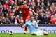 LIVERPOOL, ENGLAND - APRIL 13: Luis Suarez of Liverpool tangles with Martin Demichelis of Manchester City during the Barclays Premier League match between Liverpool and Manchester City at Anfield on April 13, 2014 in Liverpool, England. (Photo by Alex Livesey/Getty Images)