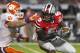 Tennessee wide receiver Marquez North (8) is tackled as he runs the ball after a catch during the annual Orange and White NCAA college spring football game on Saturday, April 12, 2014, in Knoxville, Tenn. (AP Photo/Wade Payne)