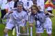 Real's Gareth Bale, left, and Luka Modric celebrate with the trophy at the end of the final of the Copa del Rey between FC Barcelona and Real Madrid at the Mestalla stadium in Valencia, Spain, Wednesday, April 16, 2014. Real defeated Barcelona 2-1. (AP Photo/Manu Fernandez)