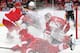 DETROIT, MI - APRIL 2: Jimmy Howard #35 of the Detroit Red Wings makes a save on Jordan Caron #38 of the Boston Bruins while teammates Justin Abdelkader #8 and Brian Lashoff #23 defend during an NHL game on April 2, 2014 at Joe Louis Arena in Detroit, Michigan. (Photo by Dave Reginek/NHLI via Getty Images)