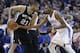 San Antonio Spurs forward Tim Duncan (21) keeps the ball fro Oklahoma City Thunder forward Kevin Durant (35) during an NBA basketball game in Oklahoma City, Thursday, April 4, 2013. (AP Photo/Sue Ogrocki)