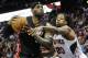 Miami Heat forward LeBron James, left, tries to keep the ball away from the defense of Atlanta Hawks forward Cartier Martin (20) during the second half of an NBA basketball game on Saturday, April 12, 2014, in Atlanta. Atlanta won 98-85. (AP Photo/John Amis)