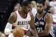 Portland Trail Blazers forward LaMarcus Aldridge, left, works the ball against SanAntonio Spurs forward Tim Duncan during the second half of an NBA basketball game in Portland, Ore., Saturday, Nov. 2, 2013. Aldridge scored 24 points as they defeated the Spurs 115-105. (AP Photo/Don Ryan)