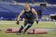 Montana linebacker Jordan Tripp runs a drill at the NFL football scouting combine in Indianapolis, Monday, Feb. 24, 2014. (AP Photo/Michael Conroy)