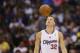 Los Angeles Clippers forward Blake Griffin looks at the ball in the air after he bounced it high while reacting to being called for a foul against the Sacramento Kings during the first half of an NBA basketball game in Los Angeles, Saturday, April 12, 2014. The Clippers won 117-101. (AP Photo/Danny Moloshok)