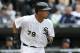 Chicago White Sox's Jose Abreu watches his RBI single off Minnesota Twins starting pitcher Ricky Nolasco, scoring Adam Eaton, during the third inning of an opening day baseball game Monday, March 31, 2014, in Chicago. (AP Photo/Charles Rex Arbogast)