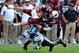 South Carolina quarterback Connor Shaw (14) is tackled by North Carolina cornerback Jabari Price (4) during the first half of an NCAA college football game, Thursday, Aug. 29, 2013 in Columbia, S.C. (AP Photo/Stephen Morton)