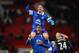 MANCHESTER, ENGLAND - DECEMBER 04: Bryan Oviedo of Everton (top) celebrates with team-mate Sylvain Distin at the end of the Barclays Premier League match between Manchester United and Everton at Old Trafford on December 4, 2013 in Manchester, England. (Photo by Michael Regan/Getty Images)