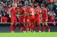 Liverpool's Martin Skrtel left, celebrates with his team-mates after he scores the second goal of the game for his side during their English Premier League soccer match against Manchester City at Anfield in Liverpool, England, Sunday April. 13, 2014. (AP Photo/Clint Hughes)