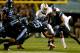 CHAPEL HILL, NC - OCTOBER 17: Dominique Green #26 of the North Carolina Tar Heels tackles Duke Johnson #8 of the Miami Hurricanes during their game at Kenan Stadium on October 17, 2013 in Chapel Hill, North Carolina. (Photo by Streeter Lecka/Getty Images)