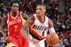 PORTLAND, OR - DECEMBER 12: Damian Lillard #0 of the Portland Trail Blazers drives to the basket against the Houston Rockets on December 12, 2013 at the Moda Center Arena in Portland, Oregon. NOTE TO USER: User expressly acknowledges and agrees that, by downloading and or using this photograph, user is consenting to the terms and conditions of the Getty Images License Agreement. Mandatory Copyright Notice: Copyright 2013 NBAE (Photo by Sam Forencich/NBAE via Getty Images)