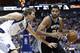 San Antonio Spurs forward Tim Duncan (21) drives against Dallas Mavericks forward Dirk Nowitzki (41) during the first half an NBA basketball game Thursday, April 10, 2014, in Dallas. (AP Photo/LM Otero)