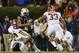 AUBURN, AL - NOVEMBER 30: Nick Marshall #14 of the Auburn Tigers is tackled by Adrian Hubbard #42 of the Alabama Crimson Tide in the fourth quarter at Jordan-Hare Stadium on November 30, 2013 in Auburn, Alabama. (Photo by Kevin C. Cox/Getty Images)