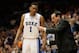 Feb 22, 2014; Durham, NC, USA; Duke Blue Devils head coach Mike Krzyzewski talks to forward Jabari Parker (1) on the sidelines against the Syracuse Orange at Cameron Indoor Stadium. Mandatory Credit: Mark Dolejs-USA TODAY Sports
