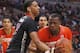 McDonald's West All-American Jahlil Okafor, left, fouls McDonald's East All-American Cliff Alexander during the second half of the McDonald's All-American boy's basketball game Wednesday, April 2, 2014, in Chicago . The West won 105-102. (AP Photo/Charles Rex Arbogast)