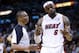 Miami Heat's LeBron James, right, reacts as he talks with official Michael Smith during the second half of an NBA basketball game against the Indiana Pacers, Friday, April 11, 2014, in Miami. The Heat defeated the Pacers 98-86. (AP Photo/Lynne Sladky)