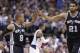 San Antonio Spurs guard Patty Mills (8) receives congratulations from Tim Duncan (21) during the second half an NBA basketball game against the Dallas Mavericks on Thursday, April 10, 2014, in Dallas. The Spurs won 109-100. (AP Photo/LM Otero)