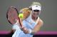 BRISBANE, AUSTRALIA - APRIL 19: Angelique Kerber of Germany plays a backhand shot against Casey Dellacqua of Australia during the Fed Cup Semi Final tie between Australia and Germany at Pat Rafter Arena on April 19, 2014 in Brisbane, Australia. (Photo by Matt Roberts/Getty Images)